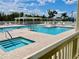 Community pool area with spa and lounge chairs at 627 Watercrest Dr, Haines City, FL 33844