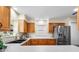 Kitchen with stainless steel appliances and light wood cabinets at 627 Watercrest Dr, Haines City, FL 33844
