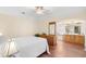Main bedroom with wood floors and ensuite bathroom access at 627 Watercrest Dr, Haines City, FL 33844