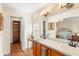 Double vanity bathroom with linen closet and bedroom view at 627 Watercrest Dr, Haines City, FL 33844