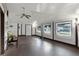 Sunroom with wood flooring, ceiling fan, and access to exterior at 6426 Jenny Dr, Lake Wales, FL 33898