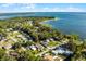 Wide aerial showcasing lakefront property and neighborhood at 6426 Jenny Dr, Lake Wales, FL 33898