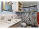 Bathroom with vanity, toilet, shower, and seashell-themed curtain at 6426 Jenny Dr, Lake Wales, FL 33898