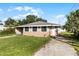 Brick house with a well-maintained lawn and driveway at 6426 Jenny Dr, Lake Wales, FL 33898