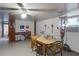 Dining room with wood table and chairs, brick accent wall, and access to hallway at 6426 Jenny Dr, Lake Wales, FL 33898