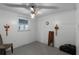 Simple bedroom with ceiling fan and window at 6426 Jenny Dr, Lake Wales, FL 33898