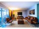 Spacious living room featuring leather furniture and a large TV at 672 Wakulla Dr, Winter Haven, FL 33884