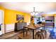 Bright dining room with a rustic wood table and metal chairs creates a stylish space at 672 Wakulla Dr, Winter Haven, FL 33884