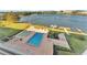 Community pool and lakefront views with boat docks at 700 Mirror Nw Ter # 508, Winter Haven, FL 33881