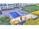 Aerial view showing pool, shuffleboard, and grilling area at 700 Mirror Nw Ter # 508, Winter Haven, FL 33881