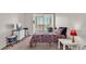 Bright bedroom with double bed and balcony access at 700 Mirror Nw Ter # 508, Winter Haven, FL 33881