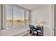 Bedroom with a lake view and home office space at 700 Mirror Nw Ter # 508, Winter Haven, FL 33881