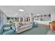 Relaxing community room features comfortable seating and plenty of natural light at 700 Mirror Nw Ter # 508, Winter Haven, FL 33881