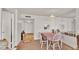 Bright dining area with window and view of hallway at 700 Mirror Nw Ter # 508, Winter Haven, FL 33881