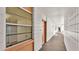 Clean condo hallway with carpeted floors at 700 Mirror Nw Ter # 508, Winter Haven, FL 33881