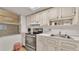 Bright kitchen features updated appliances and ample cabinetry at 700 Mirror Nw Ter # 508, Winter Haven, FL 33881