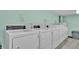 Clean and spacious laundry room with multiple commercial-grade machines at 700 Mirror Nw Ter # 508, Winter Haven, FL 33881