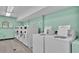 Modern laundry facility with several washers and dryers for residents at 700 Mirror Nw Ter # 508, Winter Haven, FL 33881