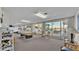 Relaxing recreation area with pool table, gym equipment, and lake views at 700 Mirror Nw Ter # 508, Winter Haven, FL 33881