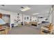 Community recreation room with pool table, fitness equipment, and seating at 700 Mirror Nw Ter # 508, Winter Haven, FL 33881
