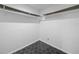 Spacious closet with dark wood shelves and hexagon tile floor at 430 N Omaha St, Lake Hamilton, FL 33851