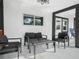 Relaxing patio area furnished with modern black seating and a coffee table at 430 N Omaha St, Lake Hamilton, FL 33851