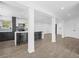 Open-concept living area with hardwood floors and kitchen island at 430 N Omaha St, Lake Hamilton, FL 33851
