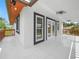 Balcony with tile flooring, offering views of the surrounding landscape at 430 N Omaha St, Lake Hamilton, FL 33851