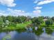 Aerial view of a lakefront home with a large yard and dock at 430 N Omaha St, Lake Hamilton, FL 33851