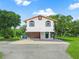 Modern two-story house with arched windows and a patio at 430 N Omaha St, Lake Hamilton, FL 33851