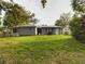 House exterior view, showcasing a large backyard at 3511 Avenue R Nw, Winter Haven, FL 33881