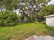 Large backyard with mature trees and playset at 3511 Avenue R Nw, Winter Haven, FL 33881