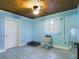Light blue bedroom with chair and pet bed at 3511 Avenue R Nw, Winter Haven, FL 33881