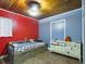 Bedroom with wood ceiling, full-size bed, and dresser at 3511 Avenue R Nw, Winter Haven, FL 33881