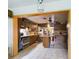 Kitchen with wood cabinets, tiled floors, and an island at 3511 Avenue R Nw, Winter Haven, FL 33881