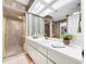 Bathroom with vanity, shower and decorative wallpaper at 209 Santa Rosa Dr, Winter Haven, FL 33884