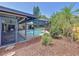 Screened-in kidney shaped pool with a partially covered patio at 209 Santa Rosa Dr, Winter Haven, FL 33884
