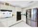 Modern kitchen featuring stainless steel appliances and white cabinetry at 209 Santa Rosa Dr, Winter Haven, FL 33884