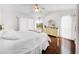Bright bedroom featuring hardwood floors and a ceiling fan at 209 Santa Rosa Dr, Winter Haven, FL 33884