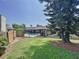 Inviting backyard oasis featuring a screened-in pool and lush landscaping at 209 Santa Rosa Dr, Winter Haven, FL 33884