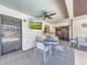 Covered patio with a ceiling fan, dining set, and view of the pool at 209 Santa Rosa Dr, Winter Haven, FL 33884
