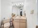 Clean bathroom with updated vanity and corner sink at 209 Santa Rosa Dr, Winter Haven, FL 33884