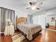 Bright bedroom with wood floors, ceiling fan, and updated decor at 209 Santa Rosa Dr, Winter Haven, FL 33884