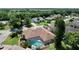 Aerial view of house, pool, and surrounding area at 209 Santa Rosa Dr, Winter Haven, FL 33884