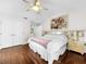 Spacious main bedroom with hardwood floors and a large bed at 209 Santa Rosa Dr, Winter Haven, FL 33884