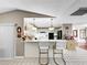 Kitchen with breakfast bar and white cabinetry at 209 Santa Rosa Dr, Winter Haven, FL 33884