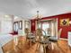 Bright dining room featuring a glass-top table and elegant chairs at 209 Santa Rosa Dr, Winter Haven, FL 33884