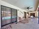 Relaxing covered patio with pool view, lounge chairs, and dining table at 209 Santa Rosa Dr, Winter Haven, FL 33884