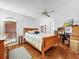 Bedroom with hardwood floors, wood bed frame and window blinds at 209 Santa Rosa Dr, Winter Haven, FL 33884