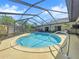 Relaxing kidney shaped pool with a screened enclosure at 209 Santa Rosa Dr, Winter Haven, FL 33884